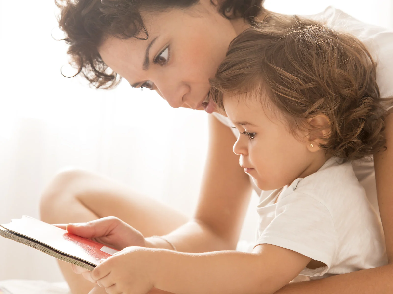 mom reading to baby