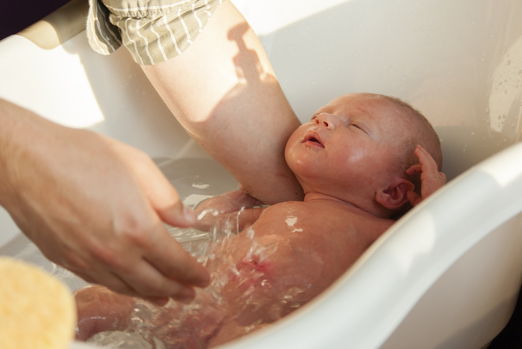 bathing baby in big bath