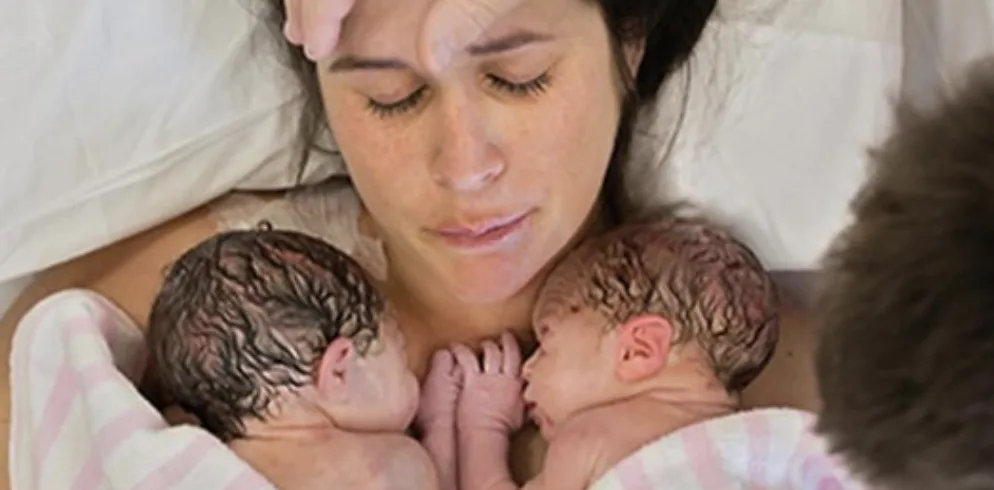 mom after birth with newborn twins