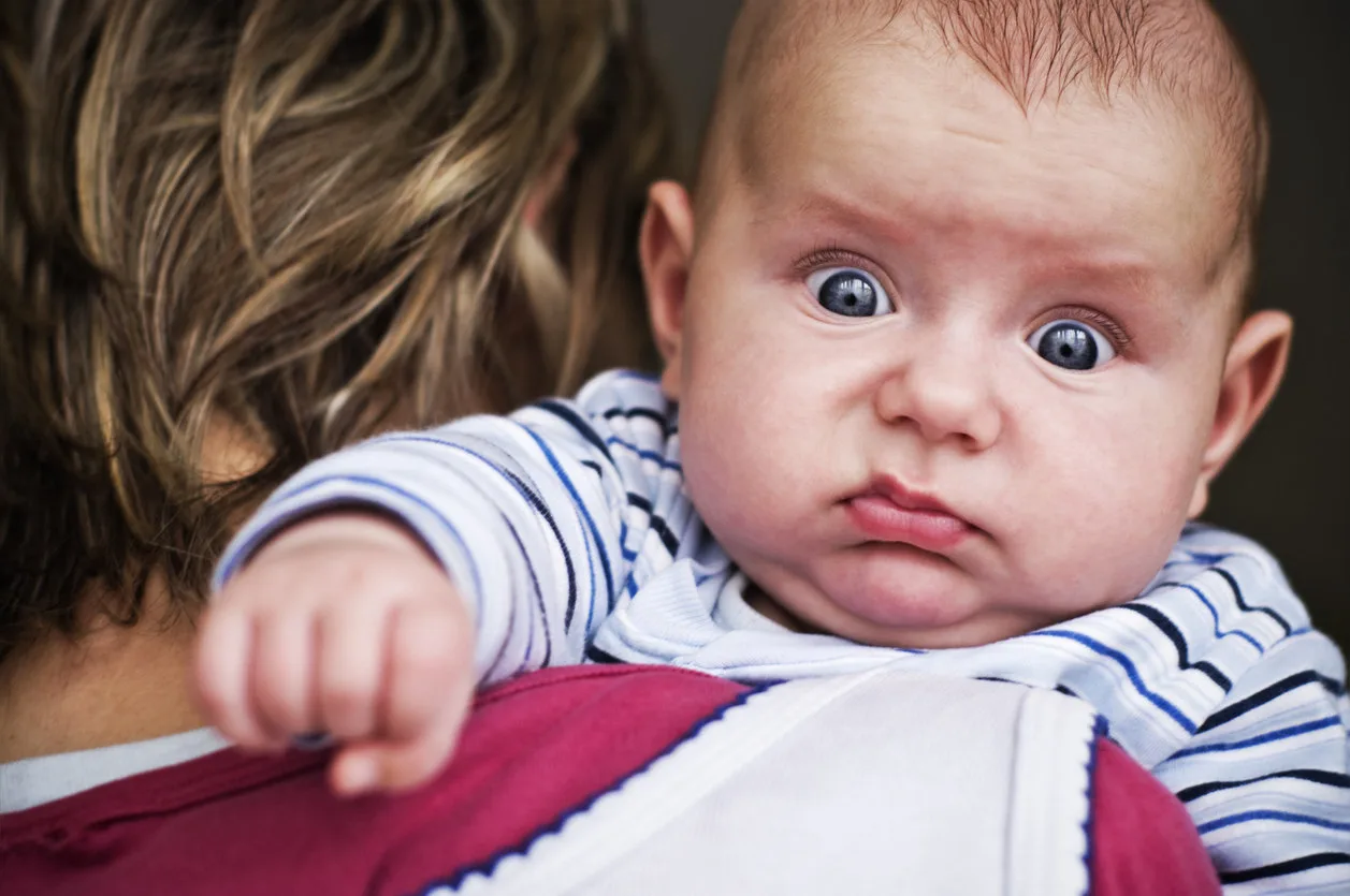 Baby boy looking with a funny expression