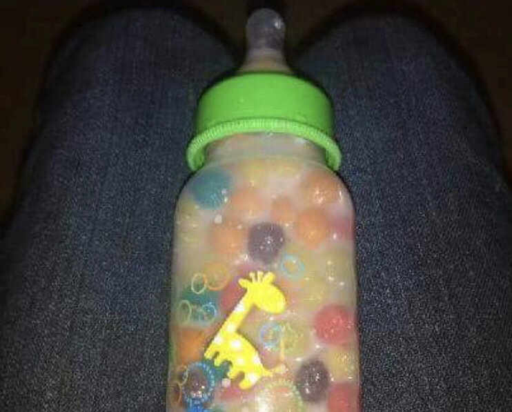 putting rice in baby bottle