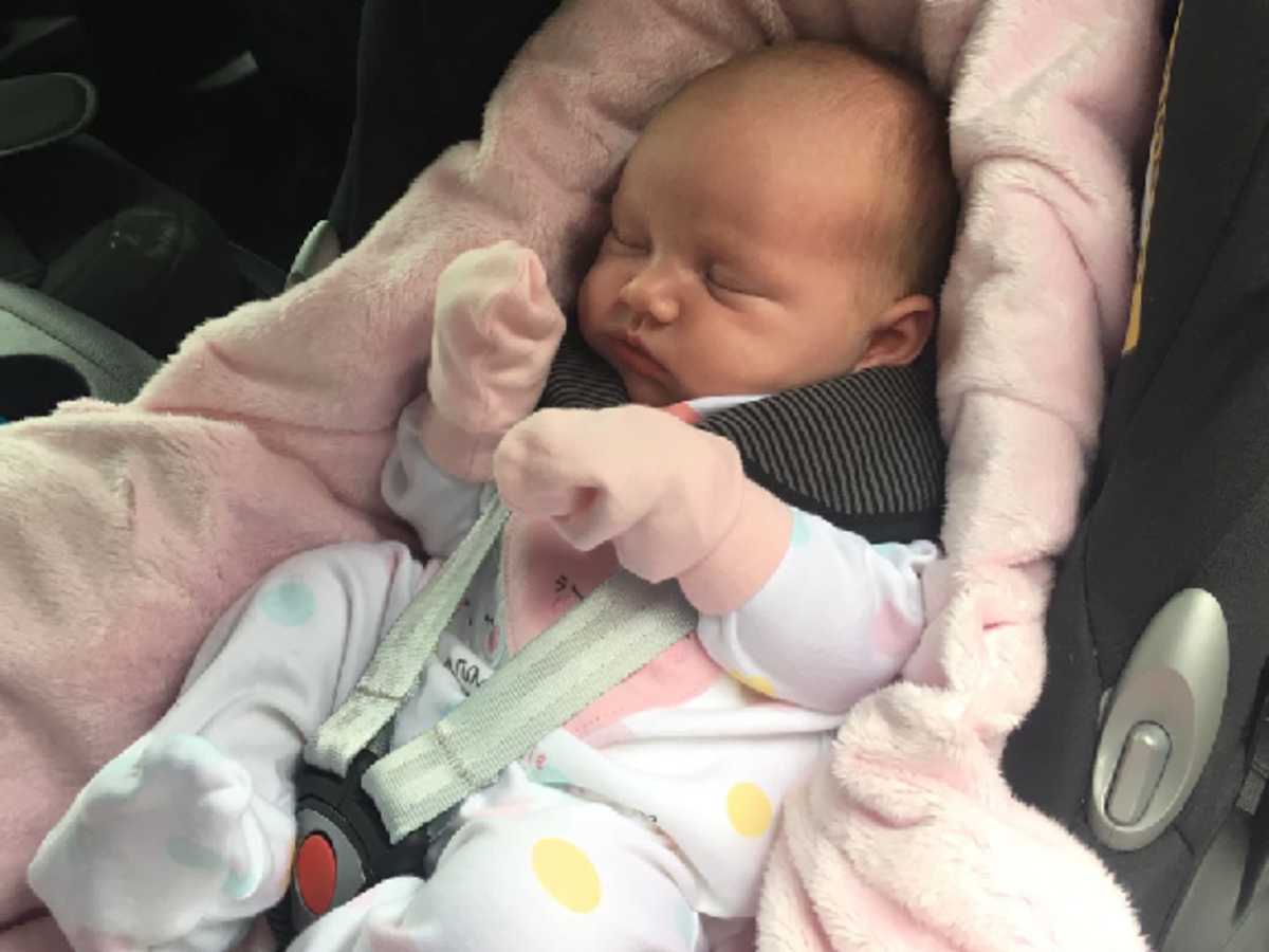 Newborn baby girl sales in car seat