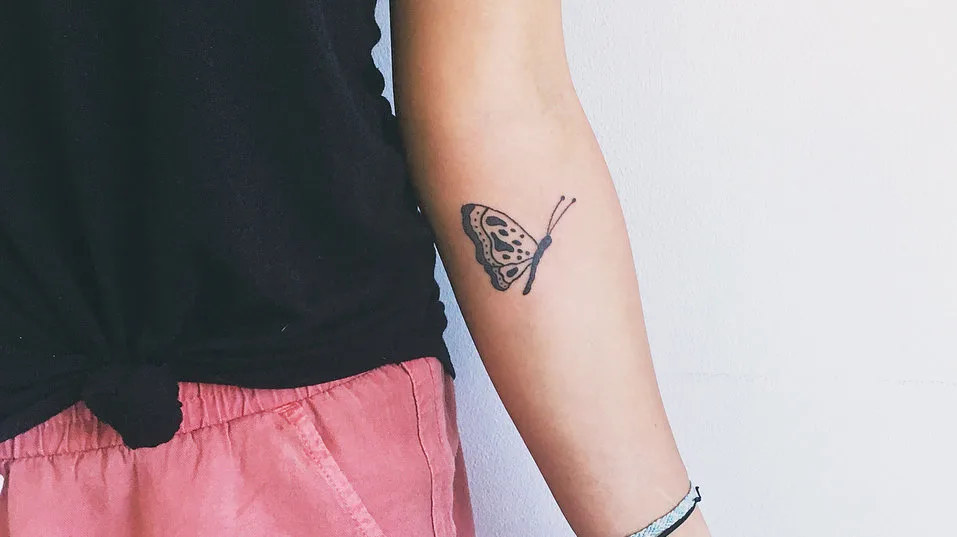 butterfly small arm tattoo