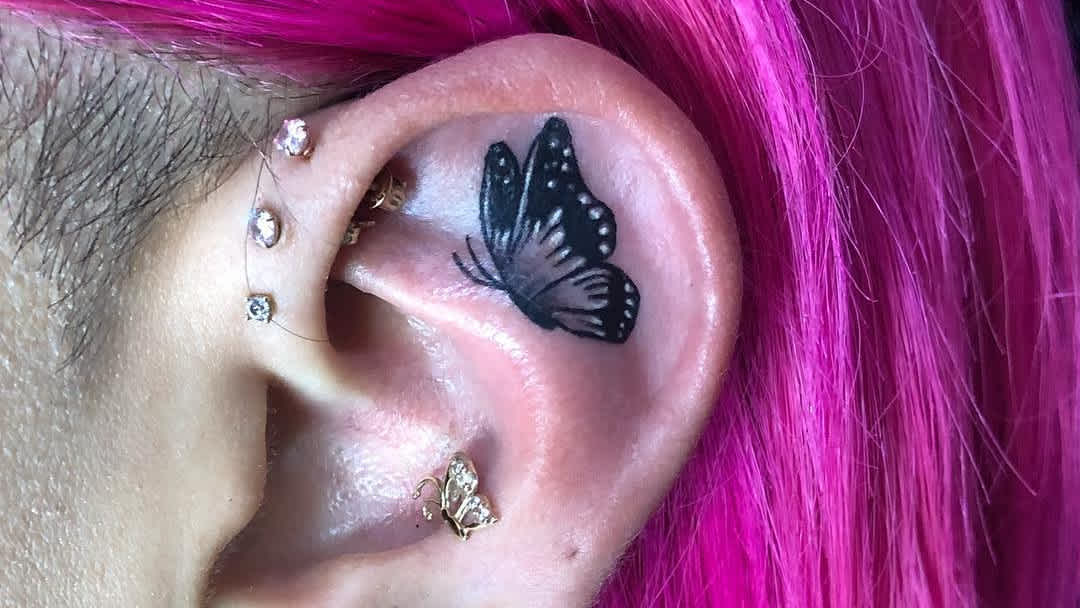 treble clef tattoo behind ear