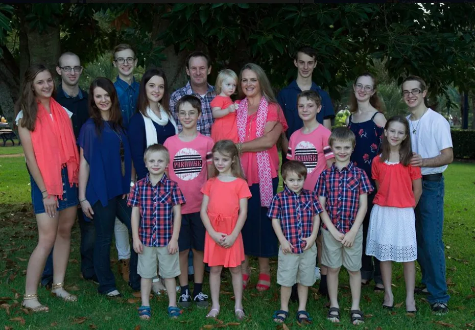 The entire Bonell family poses for a group photo outside.
