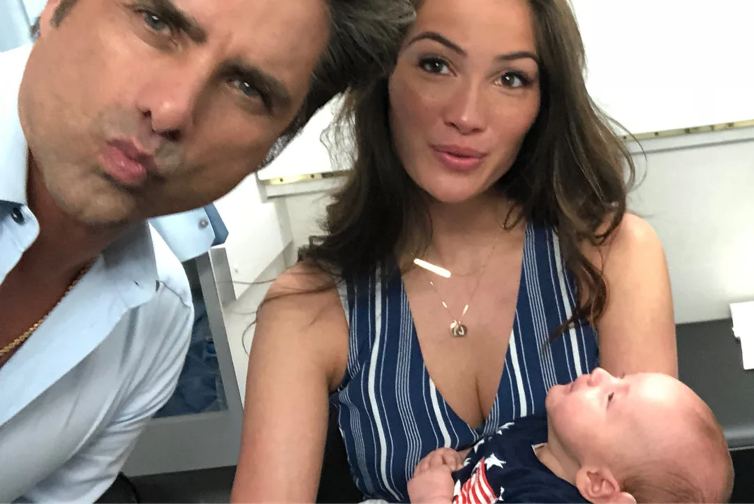 Caitlin McHugh and John Stamos with son
