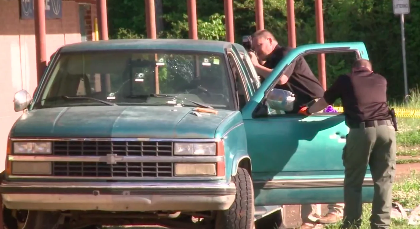 Oklahoma police investigate the pick-up truck moments after the shooting.