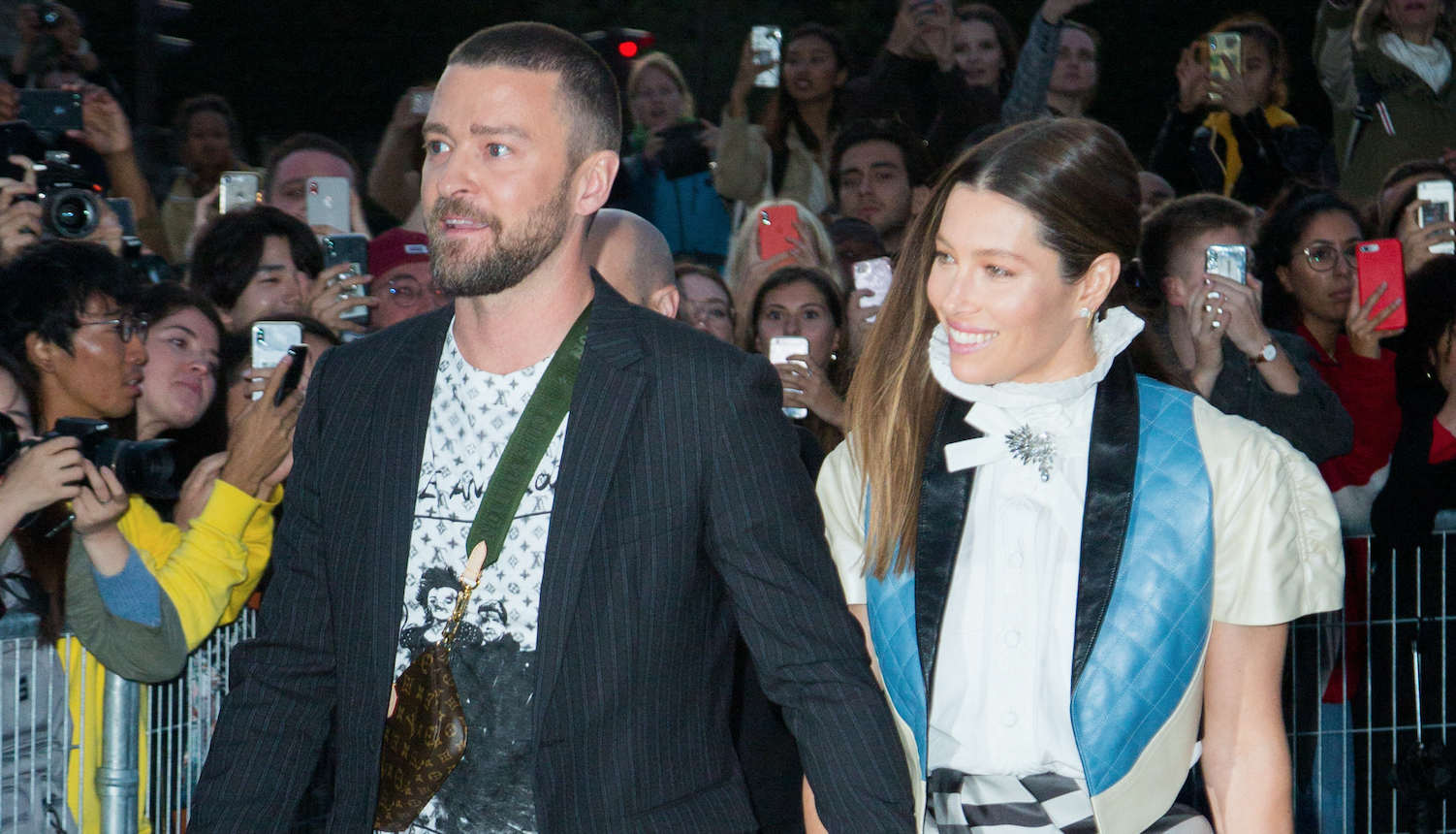 Justin Timberlake was grabbed by a prankster at Paris Fashion Week