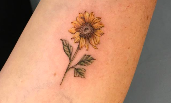 Sunflower tattoo on the inner arm