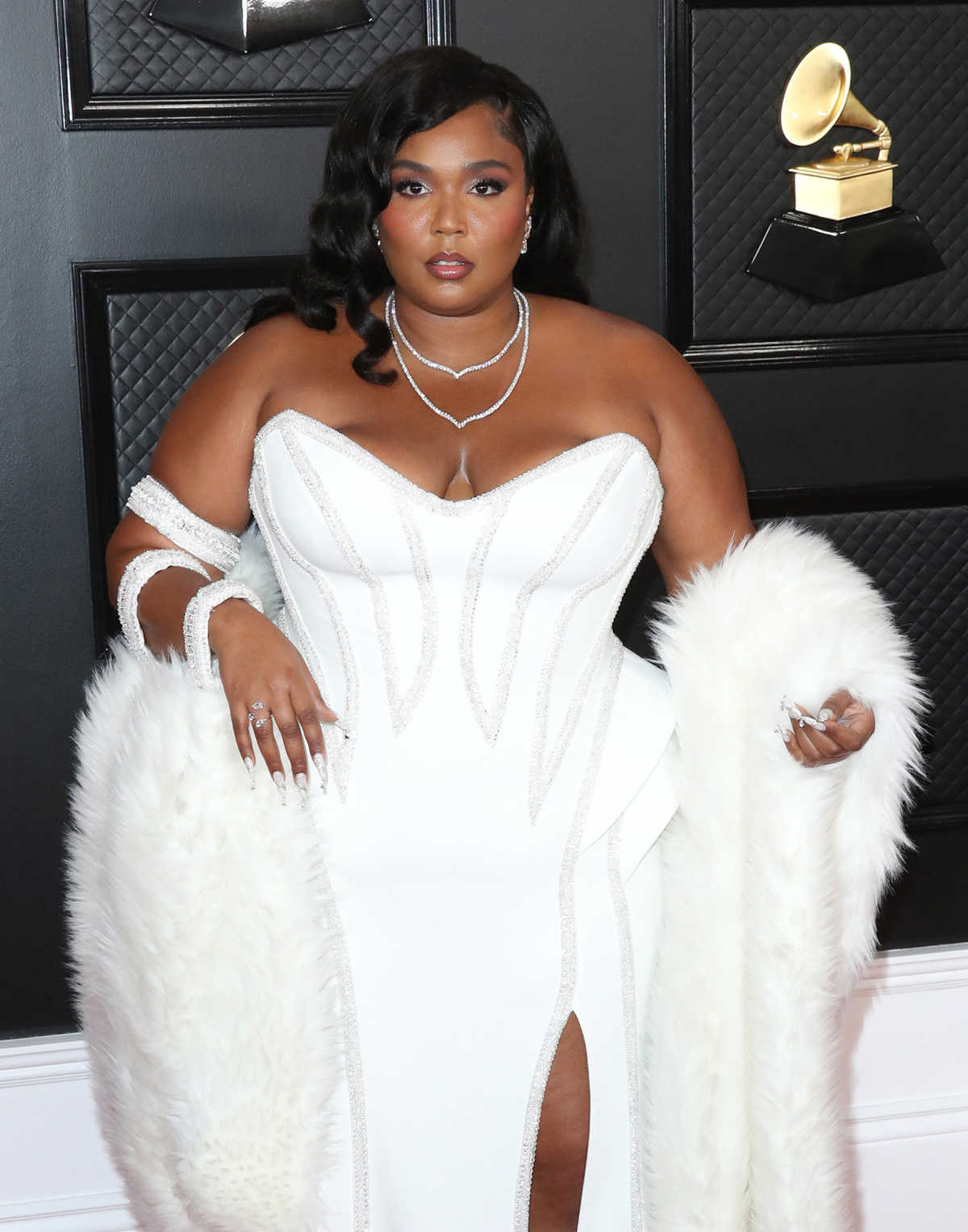 Lizzo hits out at TikTok for 'removing bathing suit videos - but