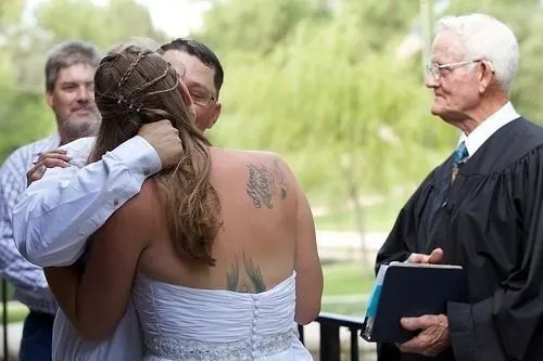 You may kiss the beautifully tattooed bride!