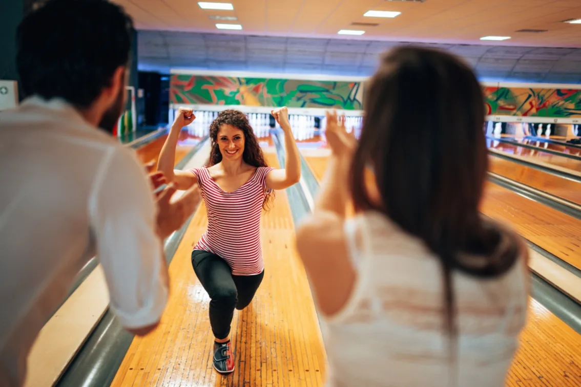 Women having fun at a bowling party