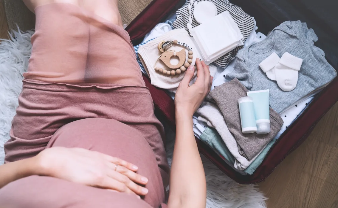 Mom-to-be opens baby gifts in private