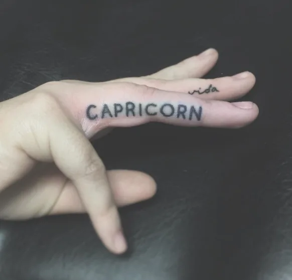 Spelled Out Zodiac Tattoo