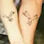 Hand Holding Father-Daughter Tattoos-placeholder