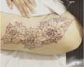 Floral Outline Hip Tattoo
