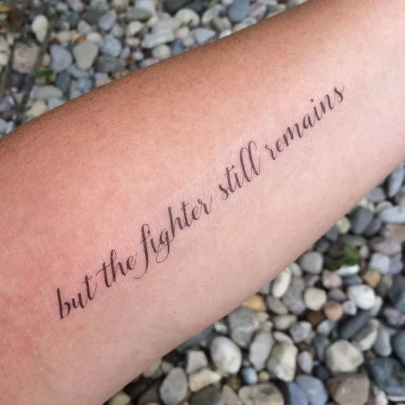 But the Fighter Still Remains Quote Tattoo