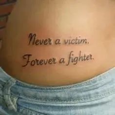 Never a Victim, Forever a Fighter Quote Tattoo