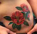 Red Flower Hip Tattoo