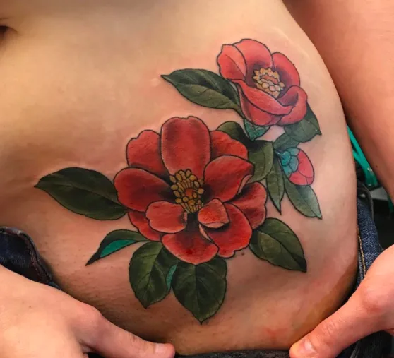 Red Flower Hip Tattoo