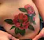 Red Flower Hip Tattoo-placeholder