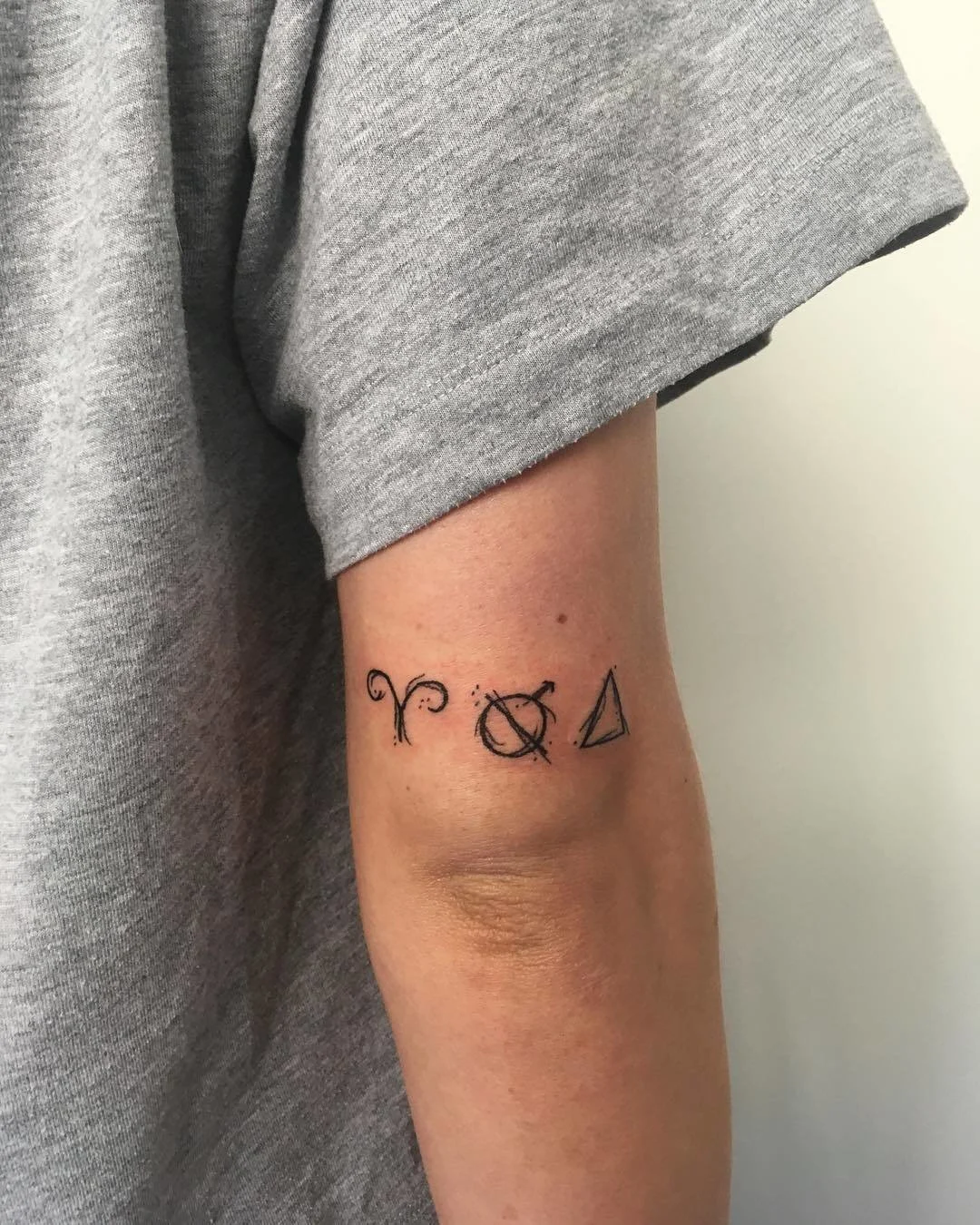 Elbow Zodiac Tattoo