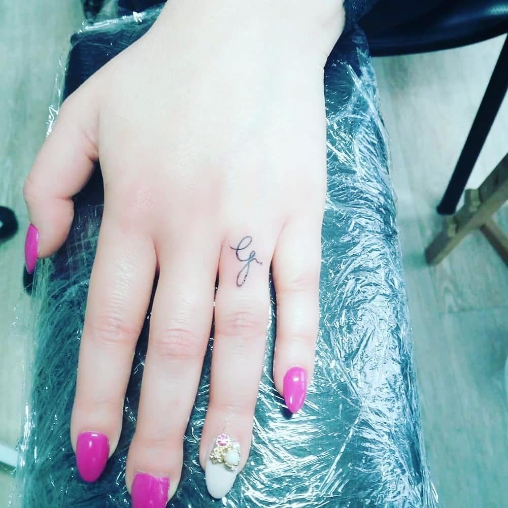 Initial Small Hand Tattoo
