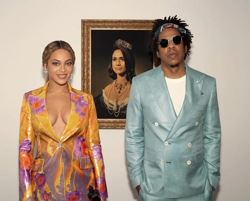 Beyonce shared this photo of her and Jay-Z standing in front of a portrait of Meghan where the Mona Lisa should be.