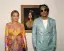 Beyonce shared this photo of her and Jay-Z standing in front of a portrait of Meghan where the Mona Lisa should be.-placeholder