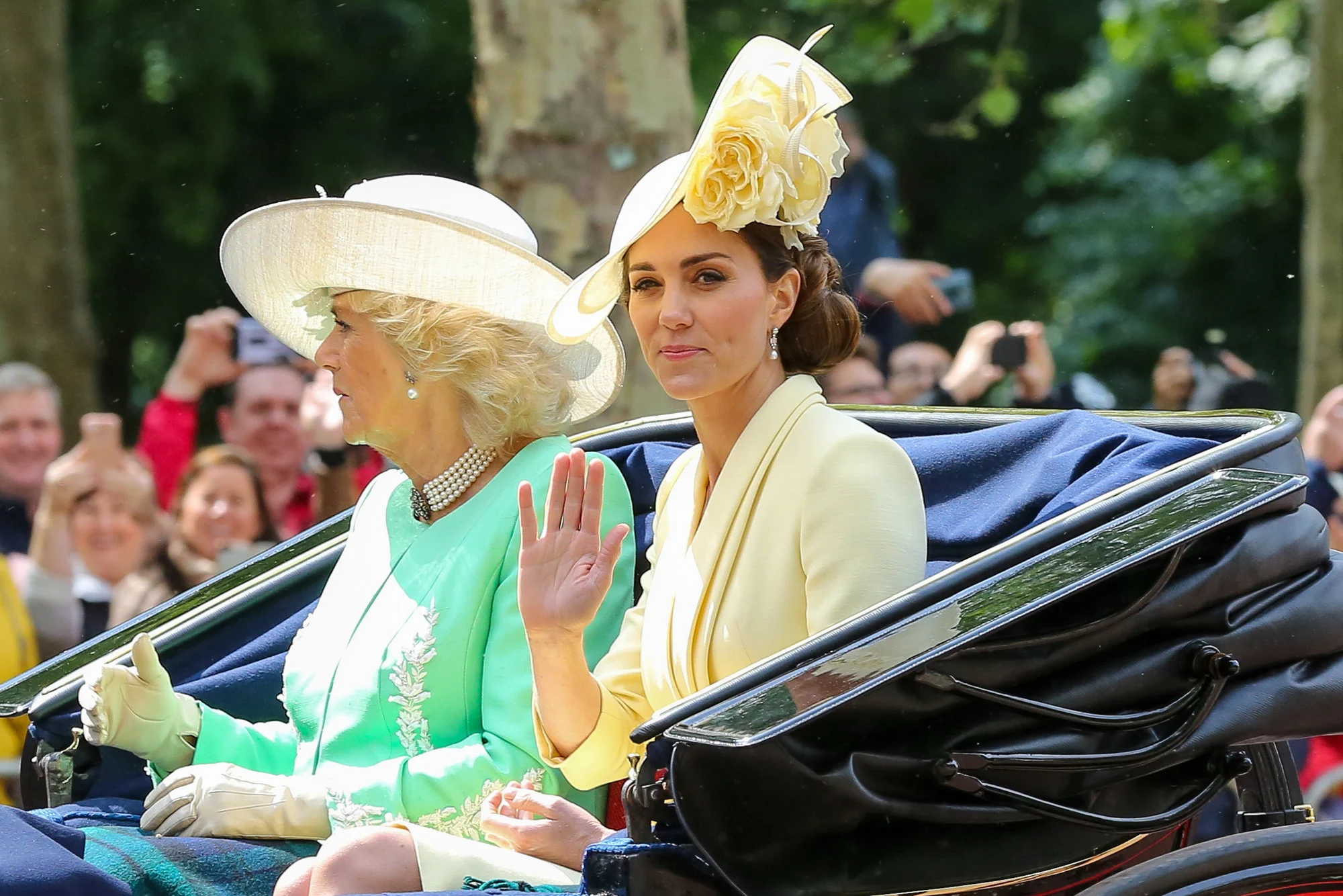 All of this grimness in carriage apparently comes from the fact that both Kate and the Queen suffer from horrible motion sickness.