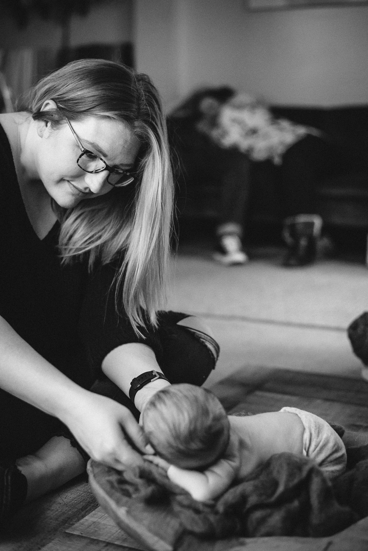 Newborn photographer Sarah Jankowski tells CafeMom that it was her assistant, Amanda Walker, who captured the magical moment.