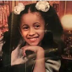Cardi B as a child with pigtails.