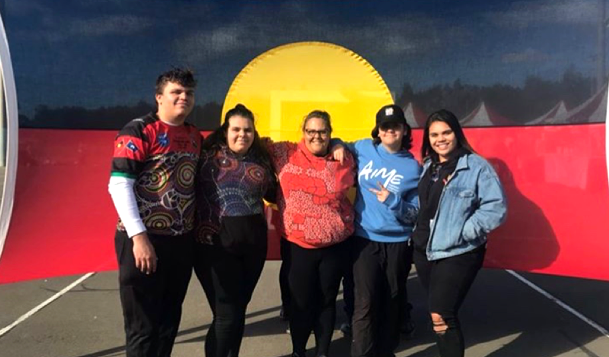 Sherice at a NAIDOC event with her mum Natalie (centre) and three younger siblings Matthew, Crystal, and Felicity (left to right).