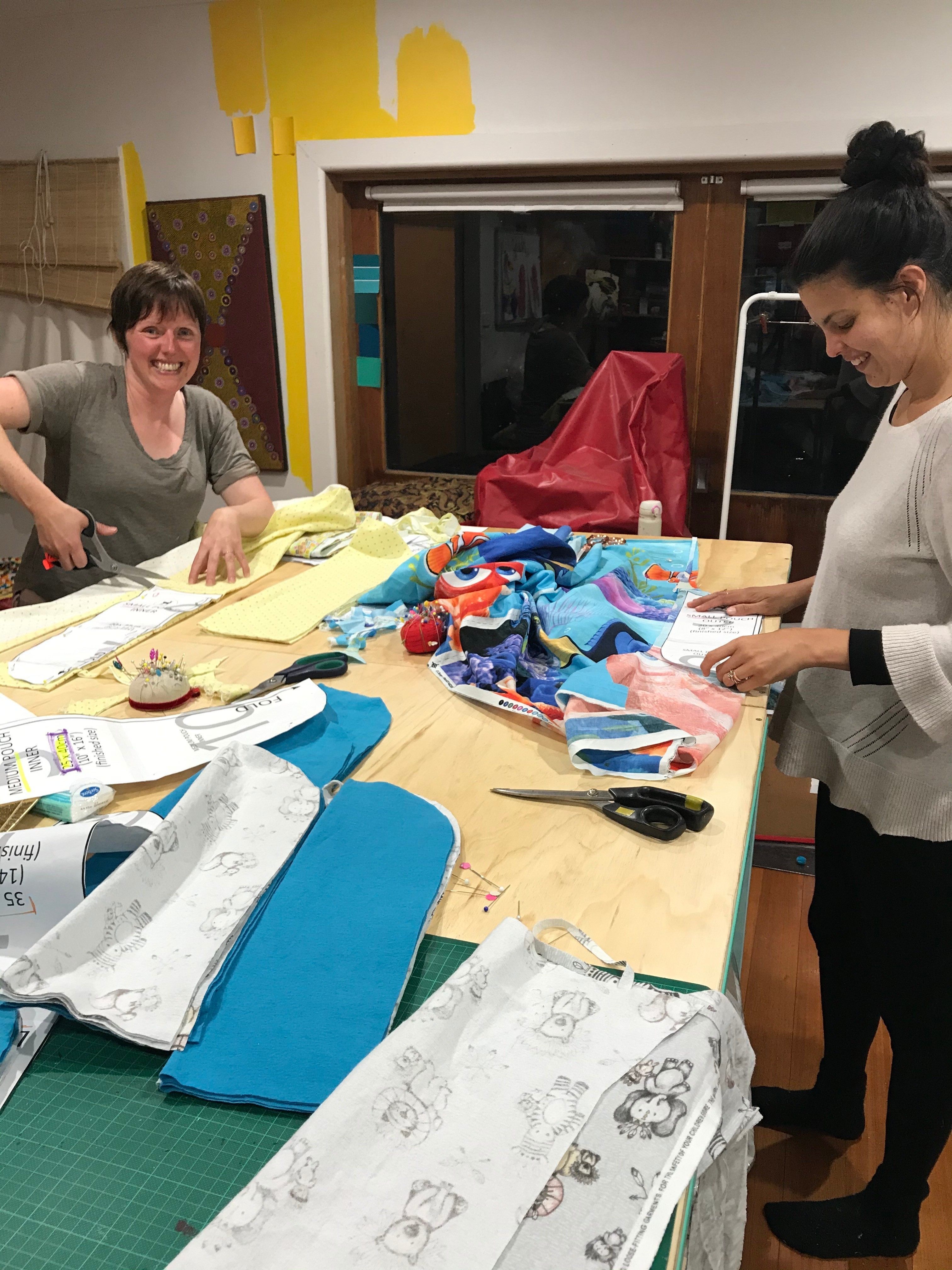 11 January 2020 - Coburg Victoria - Ronella Gomez right and Louise Pacor cut fabric pouches from patterns downloaded from