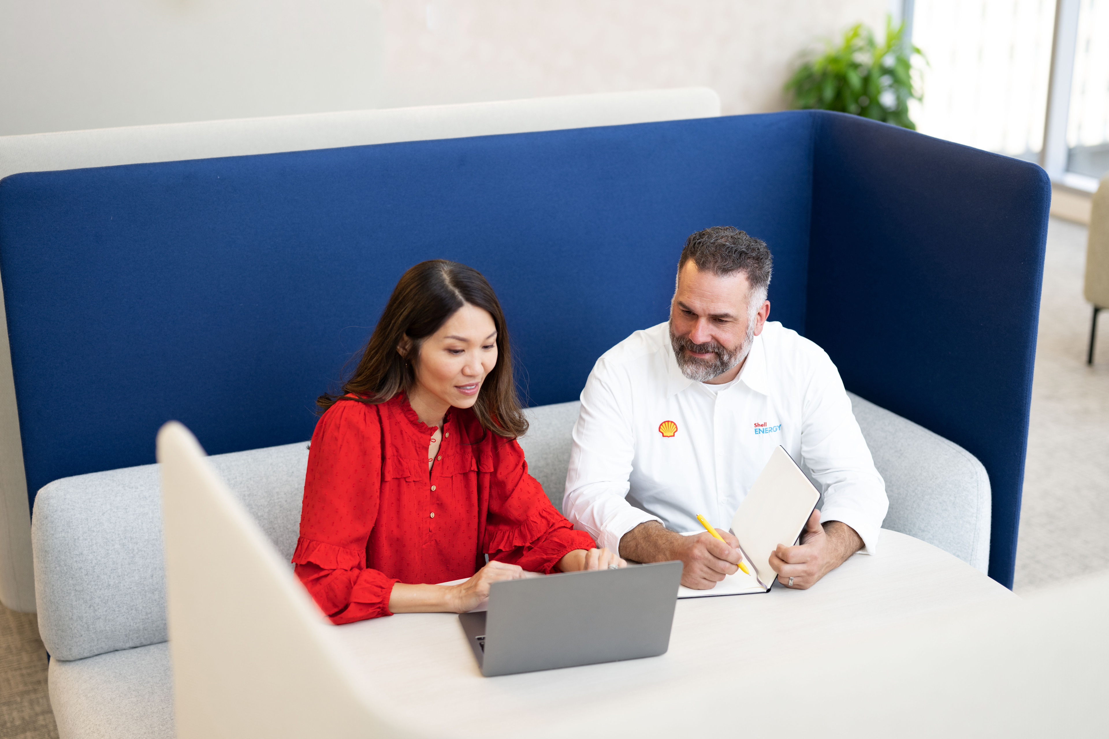 Colleagues having a discussion in a booth