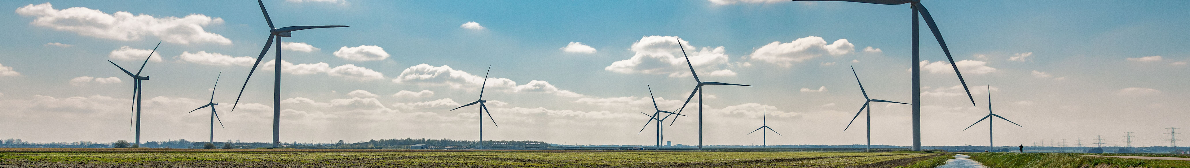 Solar energy technicians in safety gear inspecting rooftop photovoltaic panels under bright sunlight, promoting clean energy and sustainable infrastructure.