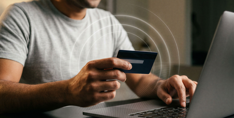 Man using credit card for online transaction