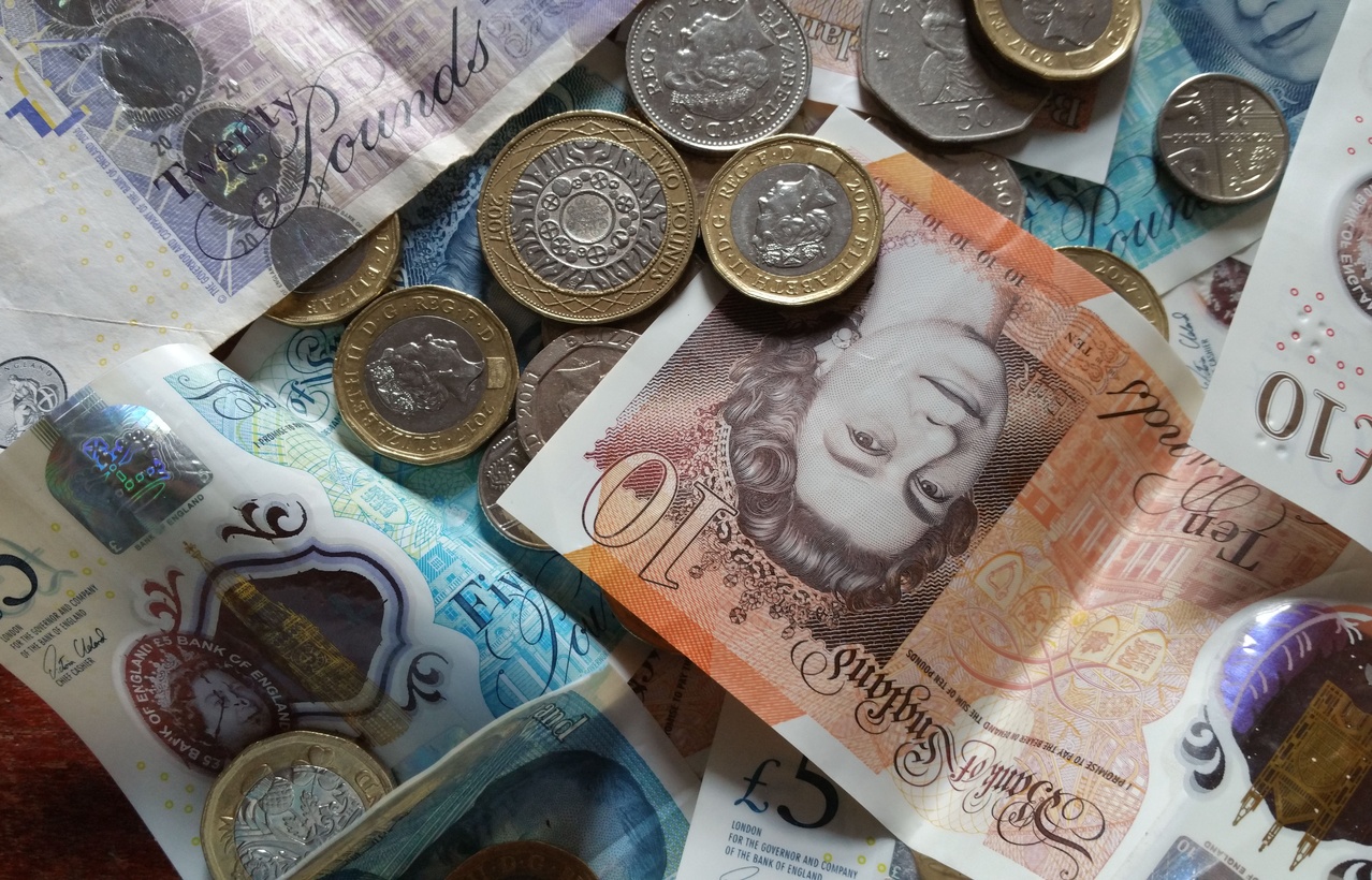 Person using British currency