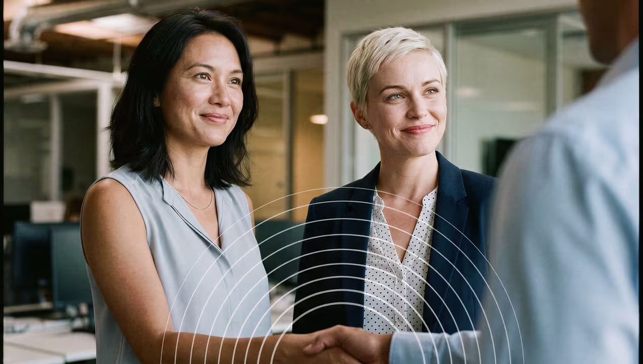 Woman shaking business associate's hand