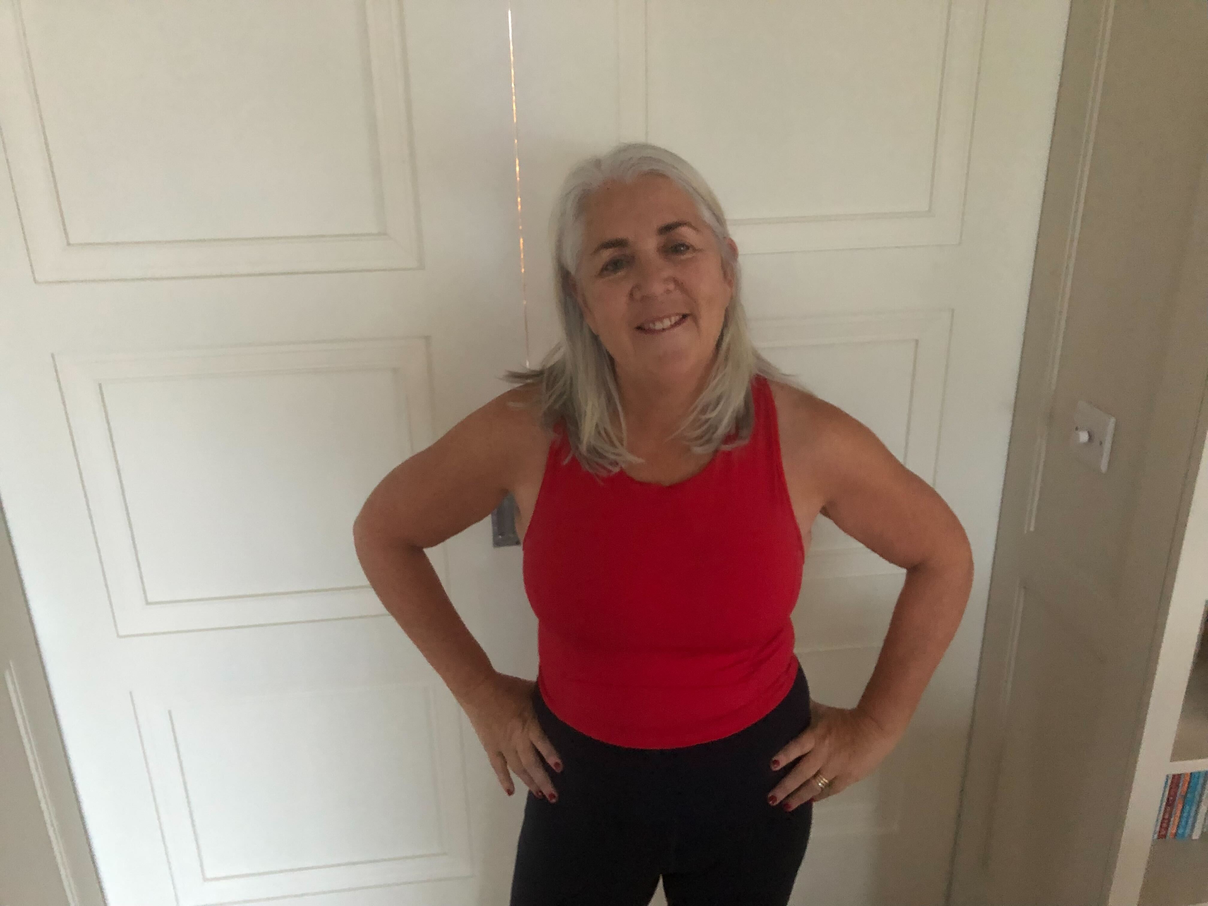 Woman exercising using The body coach app