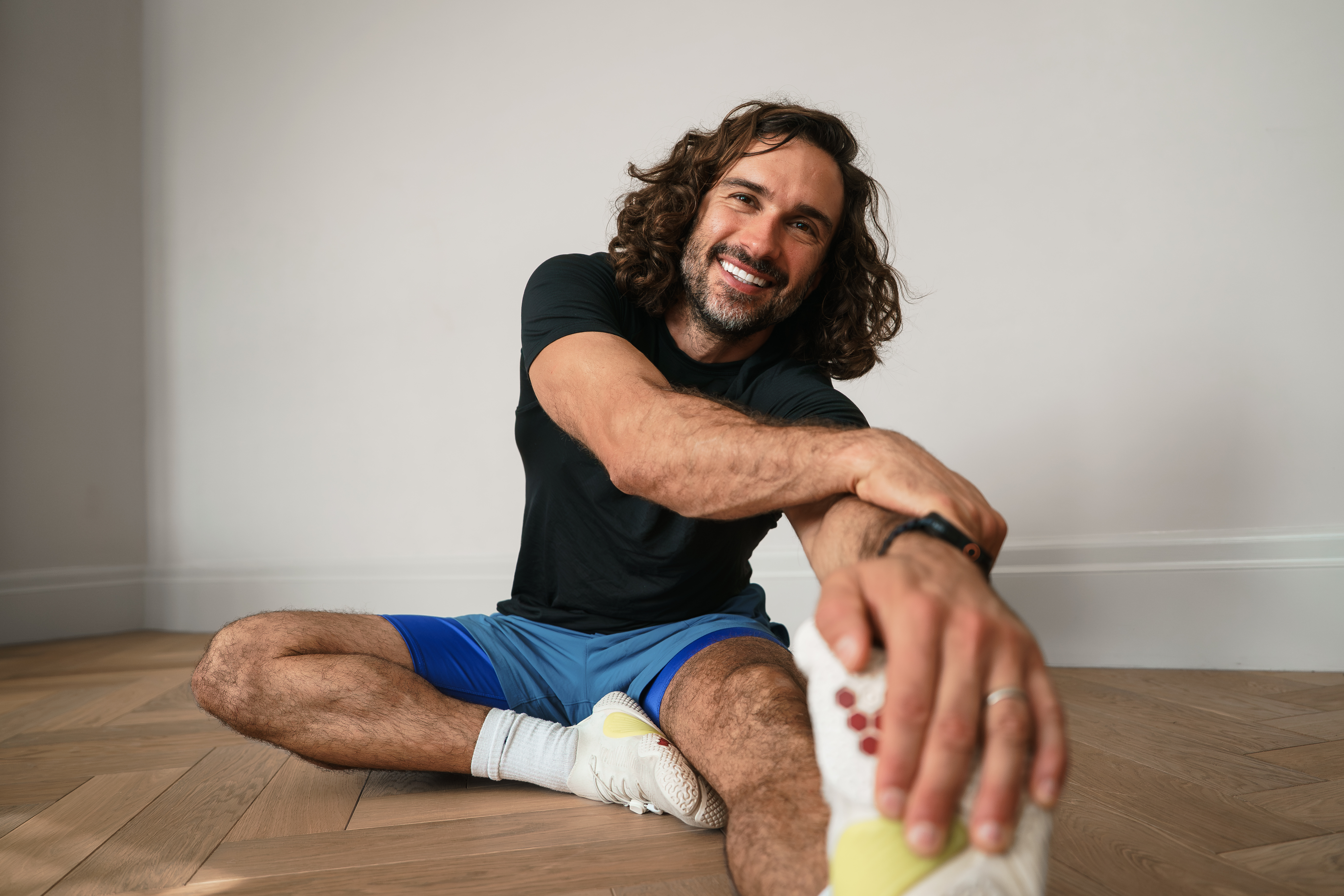 Joe smiling while doing a HIIT workout post stretch