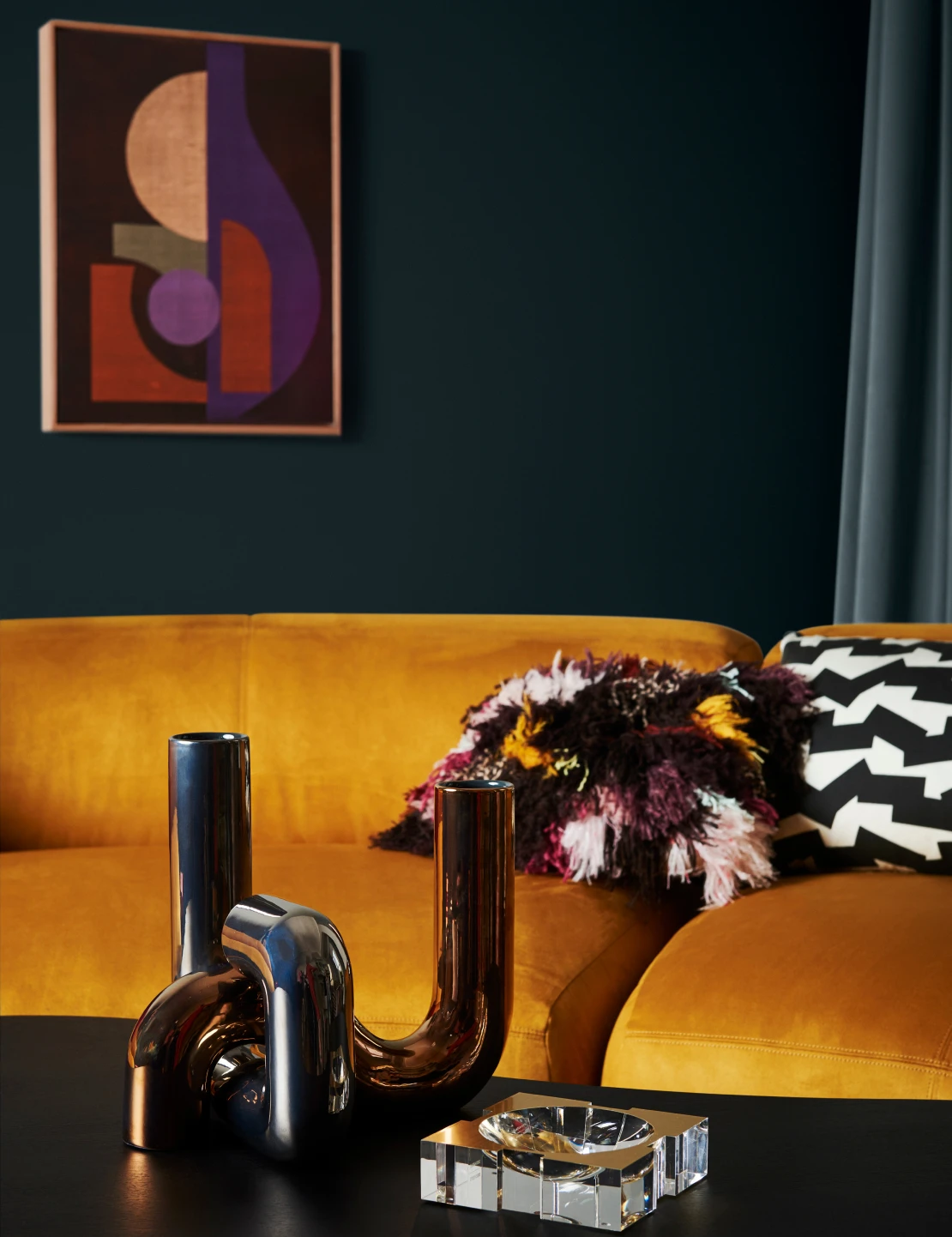 Interior living room with Benang coloured wall, yellow plush couch and Dark Door coloured coffee table 