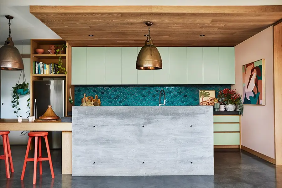 interior kitchen island bench and concrete bench wall.
