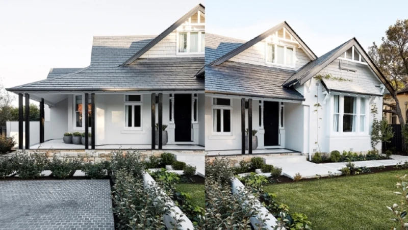 Traditional white house with black shingle roof