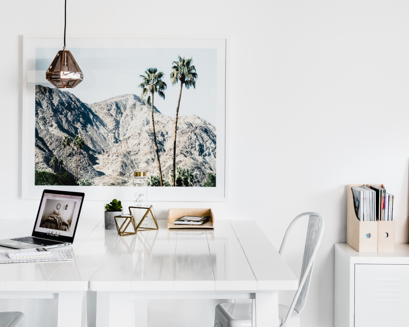 interior white study with table and painting. 