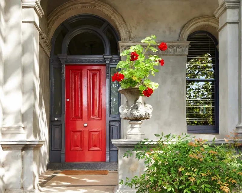 Front door in Dulux Aquanamel® Symphony Red and trim in Dulux Aquanamel® Leadman. Stylist: Heather Nette King. Photographer: Mike Baker. 