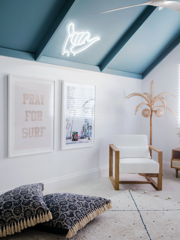 Statement features white wall, ocean coloured pitched ceiling in living area