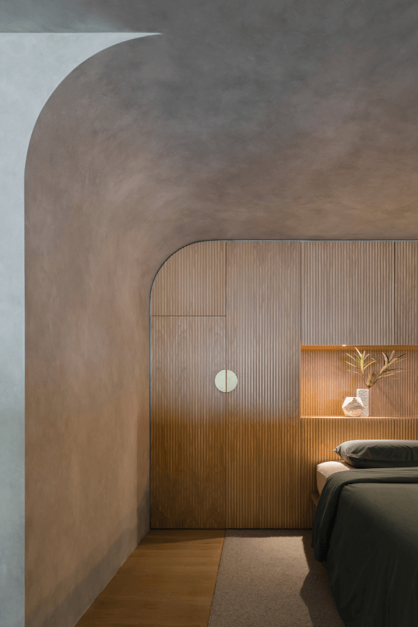 timber bedroom with curved wall