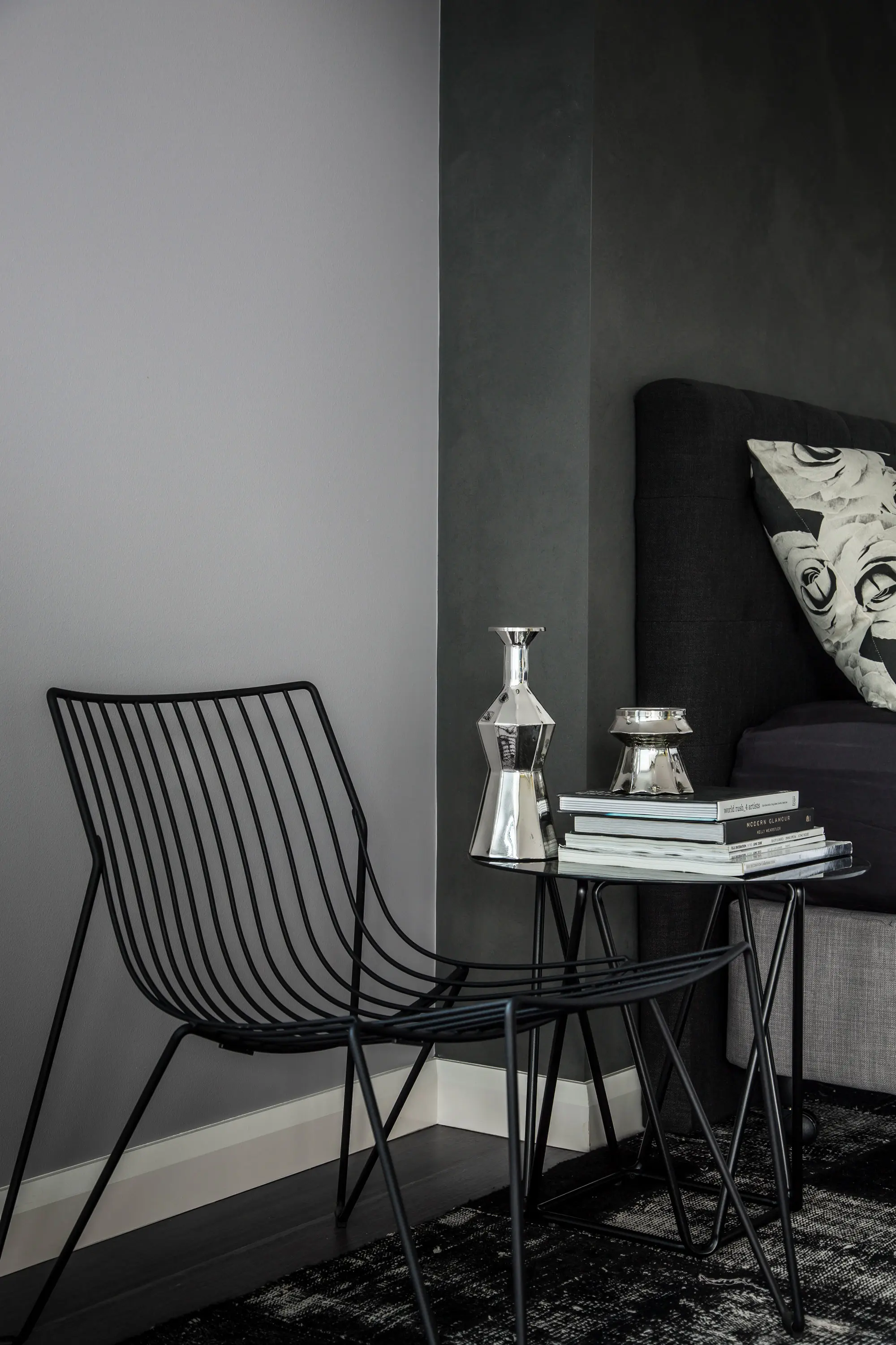 Black wire chair in grey room