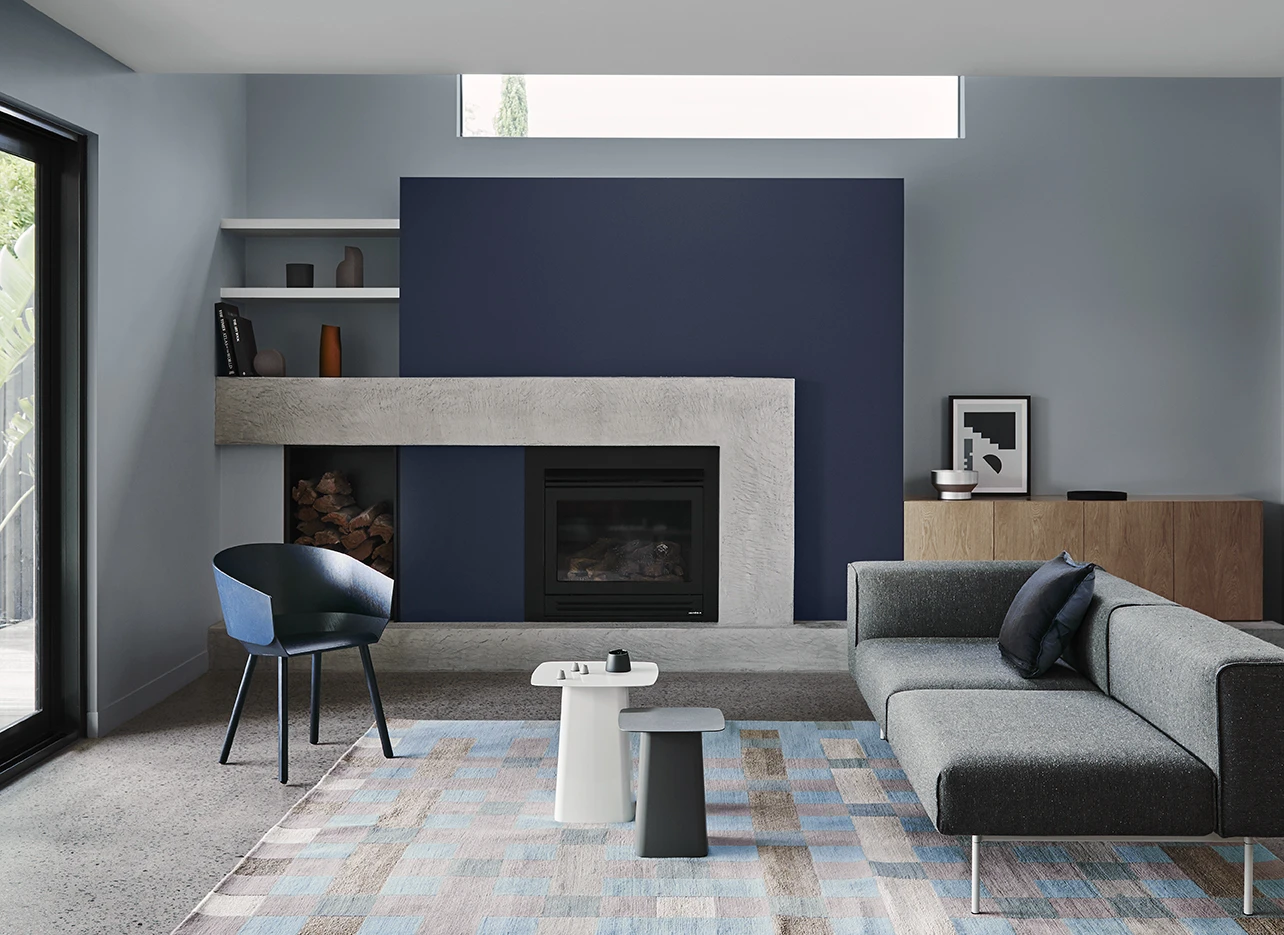 Fireplace with blue block paint on the walls around it.